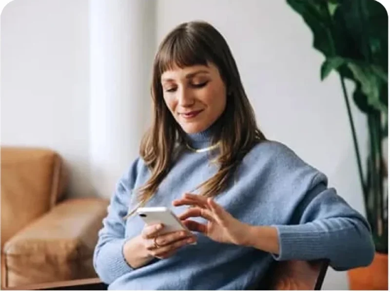 Woman filling out the altRx online health assessment on a smartphone