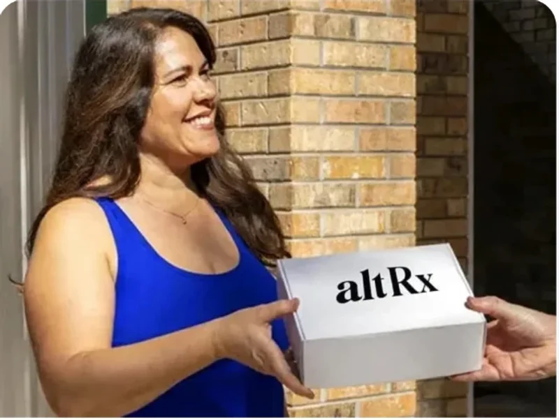 Woman at her front door accepting an altRx medication package